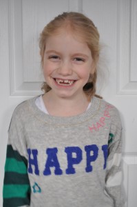 Day 311: My girl wearing her new favourite 'Happy' jumper. This smile was pretty much the only one she gave all day, but even one minute of sunshine is better than none.