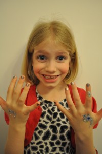 Day 380: Mimi, just returned from a 'pamper party' for one of her friend's birthday, sporting glittery sticker tattoos, sparkly nail varnish, eyeshadow, blusher and lipstick :)