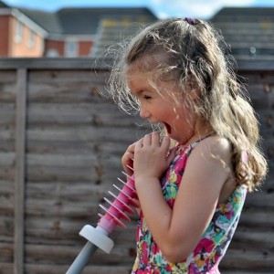 Day 523: This one absolutely loves to sing and can often be found standing in front of the mirror in my bedroom watching herself as she belts out made-up songs at top volume. But the second she realises she's being watched, she stops. Today I watched her secretly through the kitchen window as she stood at the top of the slide in the garden singing her heart out. After a little persuasion she allowed me to capture a couple of shots, and for that I am very grateful.