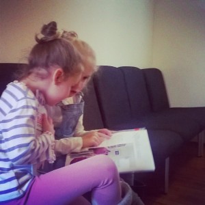 Day 237: The girls love our twice-yearly trip to the dentist (mainly because they get stickers!). Here are Mimi and Lola in the waiting room practising their reading.